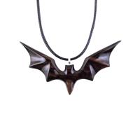Black and brown reversible wooden flying bat pendant with 18 inches black cord necklace with lobster clasp.
