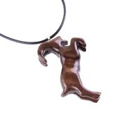 A wooden pendant shaped like a goat standing on its hind legs. The pendant is brown and has a natural wood grain pattern. The pendant is hanging from a black cord.