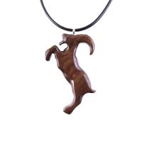 A wooden pendant shaped like a goat standing on its hind legs. The pendant is brown and has a natural wood grain pattern. The pendant is hanging from a black cord.
