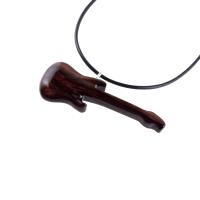 A wooden guitar pendant necklace with a black cord. The guitar is dark reddish- brown with a wood grain pattern.