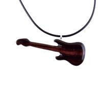 A wooden guitar pendant necklace with a black cord. The guitar is dark reddish- brown with a wood grain pattern.