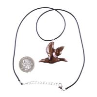 A dark brown wooden duck pendant on a black cord necklace with silver lobster clasp. The bird is carved in flight with its wings spread out.