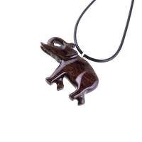 A dark brown wooden elephant pendant necklace with a black cord.