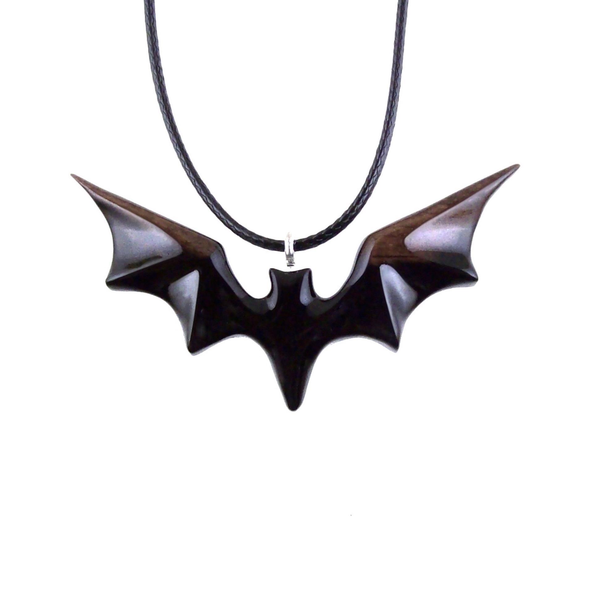 Black and brown reversible wooden flying bat pendant with 18 inches black cord necklace with lobster clasp.