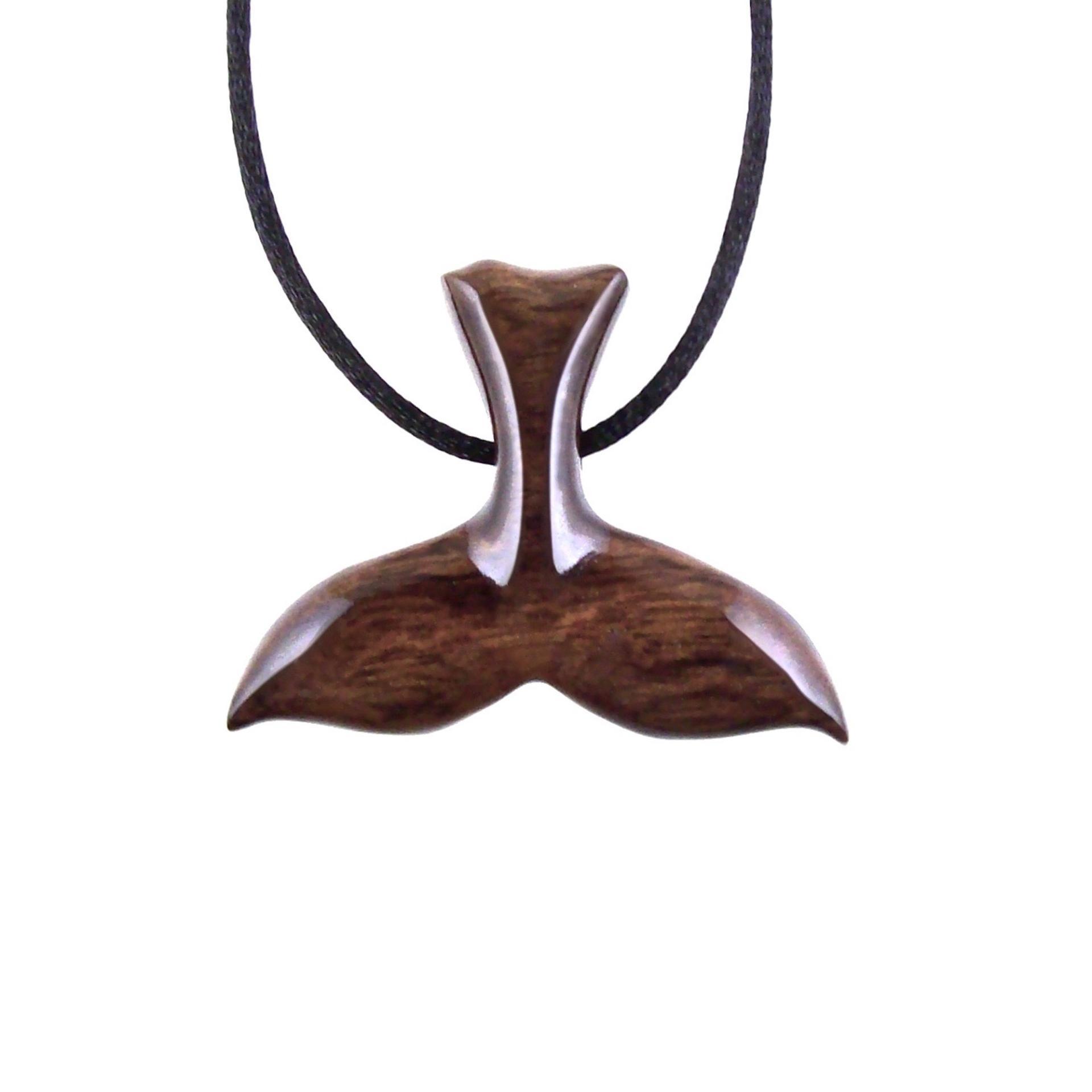 Reversible brown wooden whale tail pendant with black satin cord necklace.