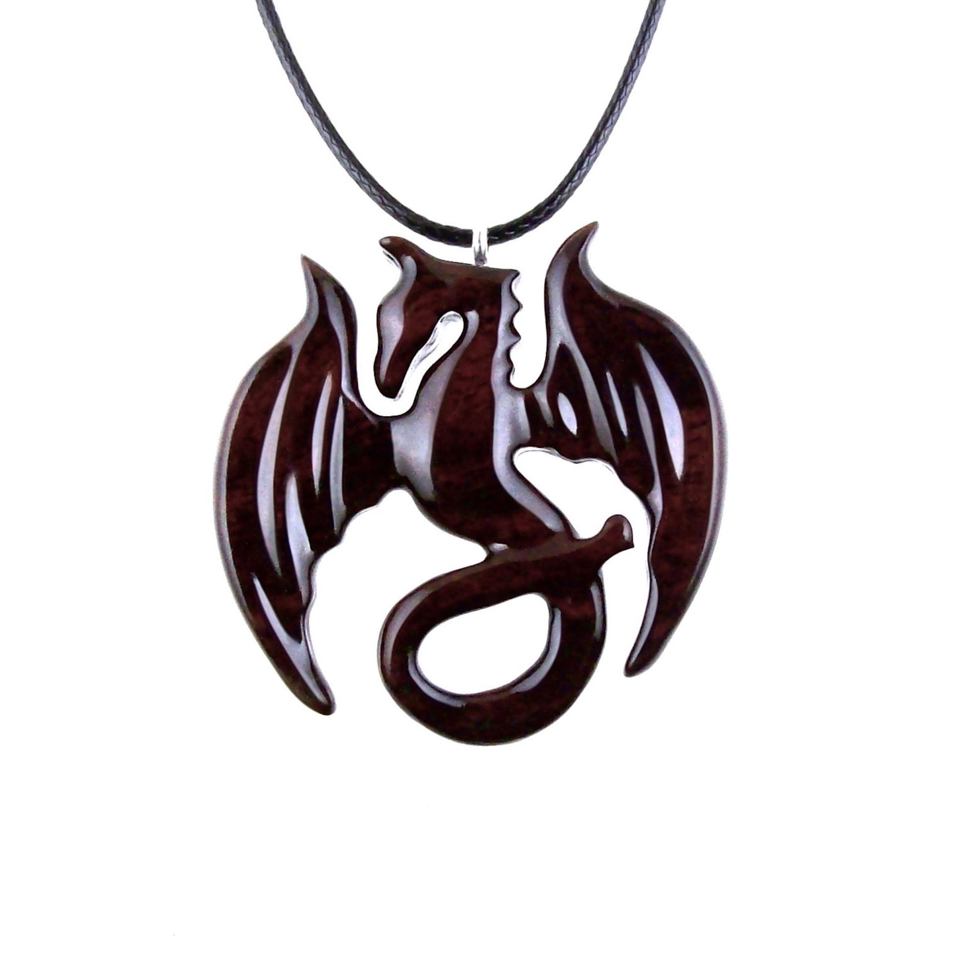 Reddish-Brown Reversible Wooden Dragon Pendant with 18 inches black cord necklace with lobster clasp closure.