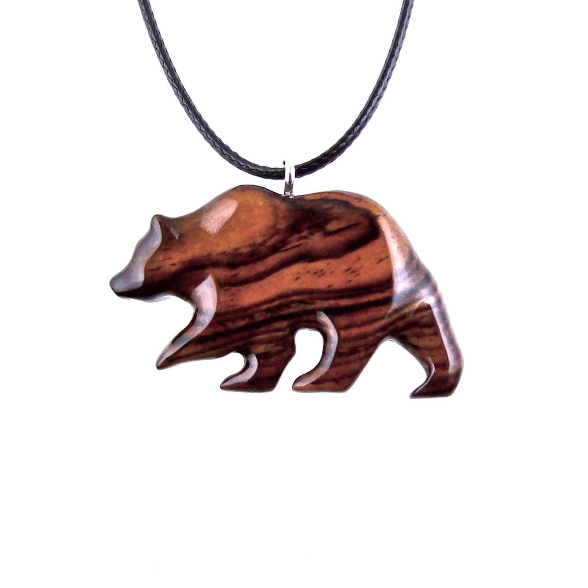 Reddish-brown reversible wooden walking bear pendant with 18 inches black cord necklace with lobster clasp.