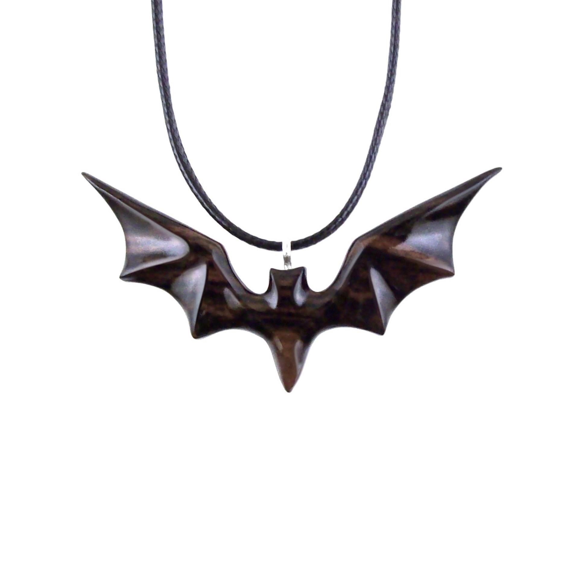 Black and brown reversible wooden flying bat pendant with 18 inches black cord necklace with lobster clasp.