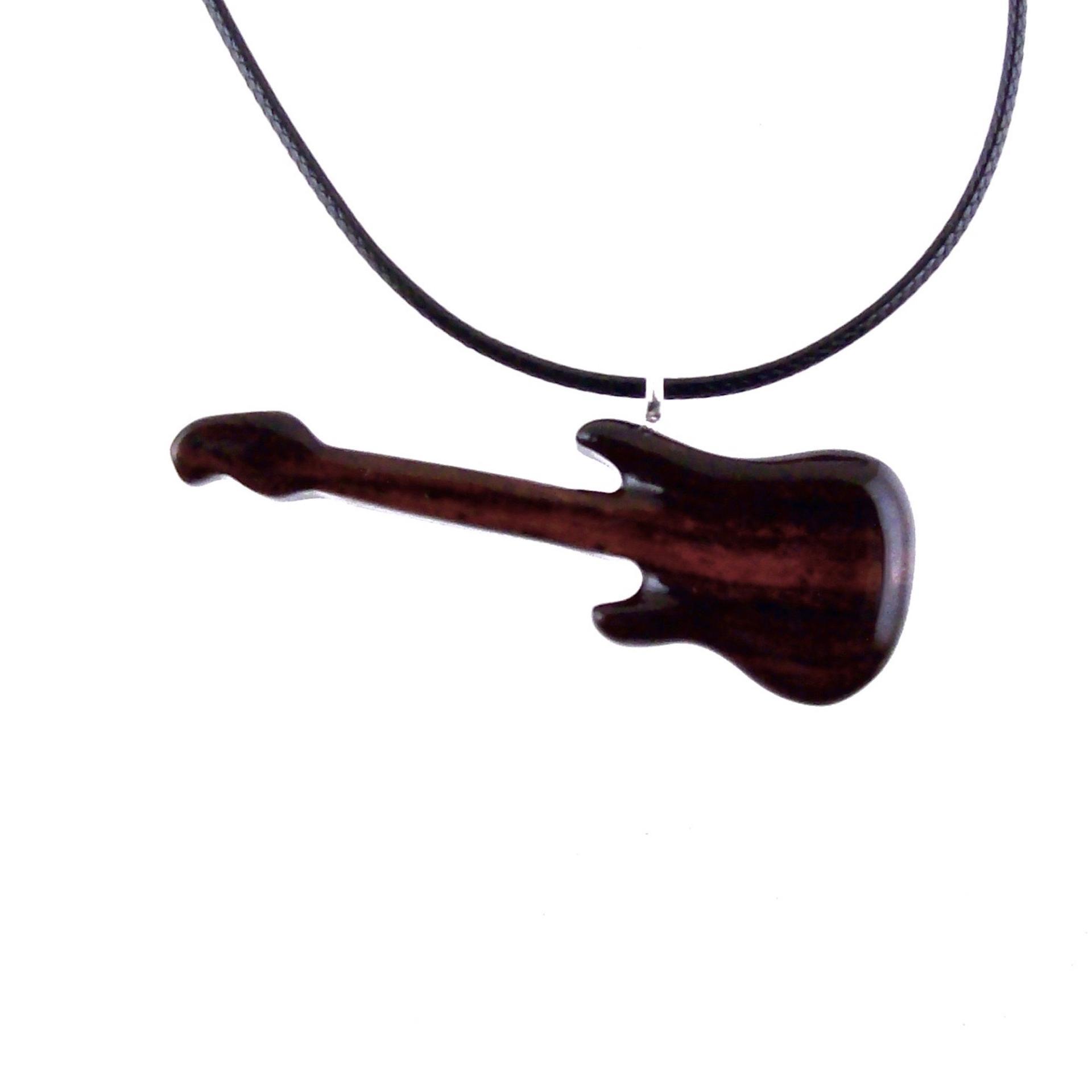 A wooden guitar pendant necklace with a black cord. The guitar is dark reddish- brown with a wood grain pattern.