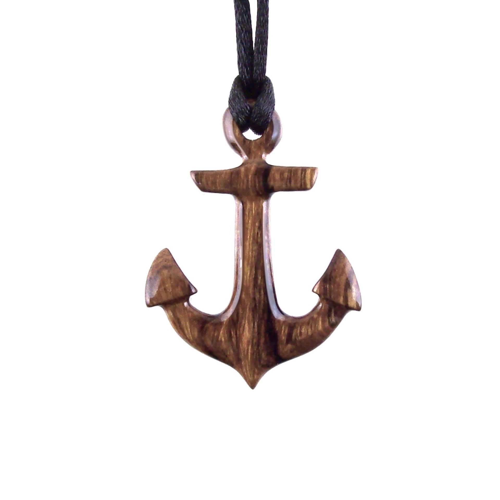 A wooden anchor pendant necklace with black satin cord.