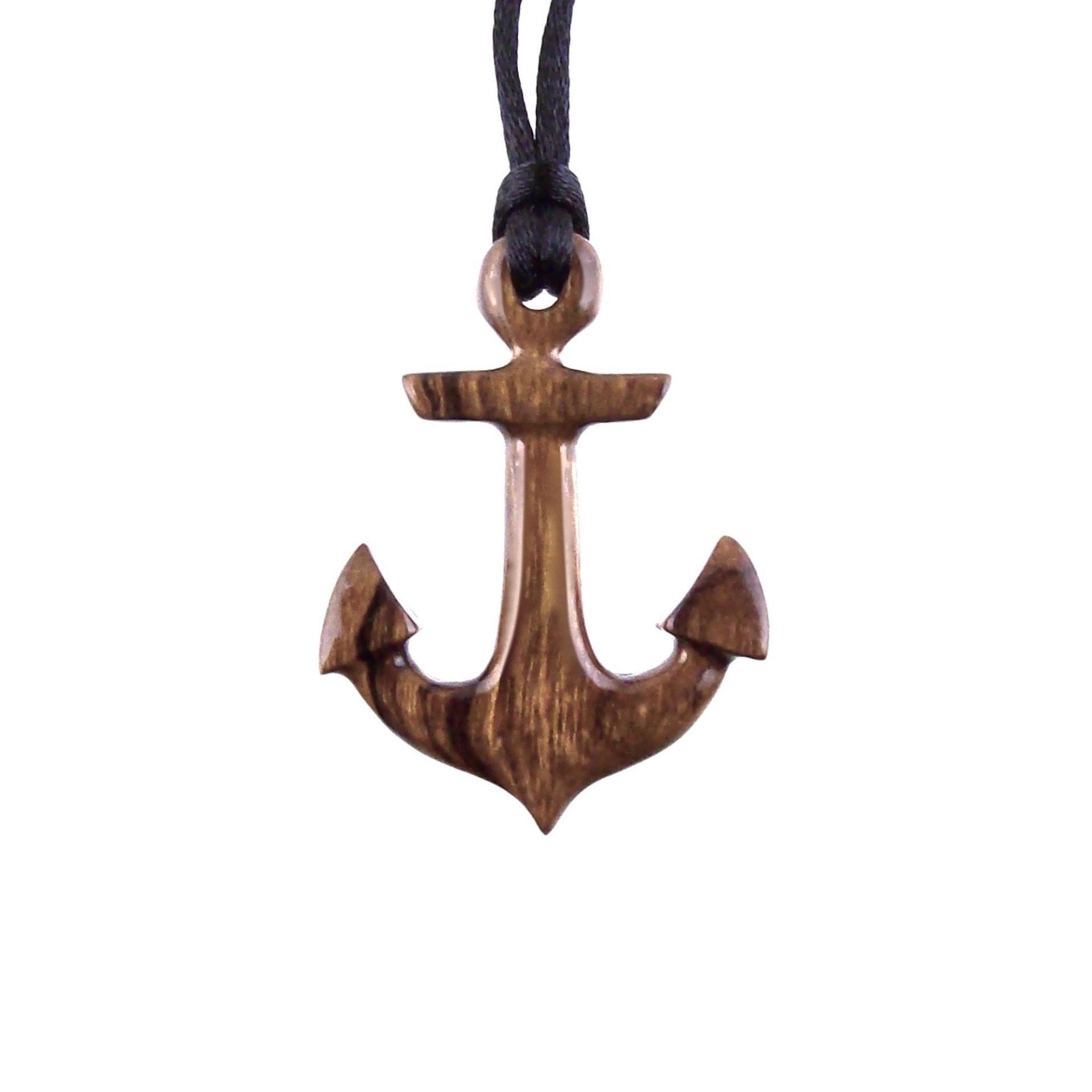A wooden anchor pendant necklace with black satin cord.