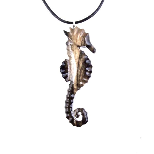 Black with cream streaks reversible wooden seahorse pendant with 18 inches black cord necklace with lobster clasp.