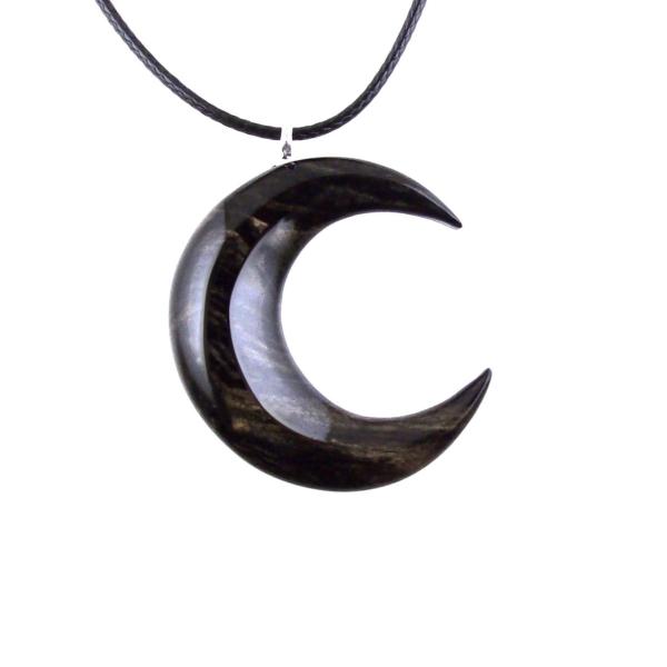 Black with cream streaks reversible wooden crescent moon pendant with 18 inches black cord necklace with lobster clasp.